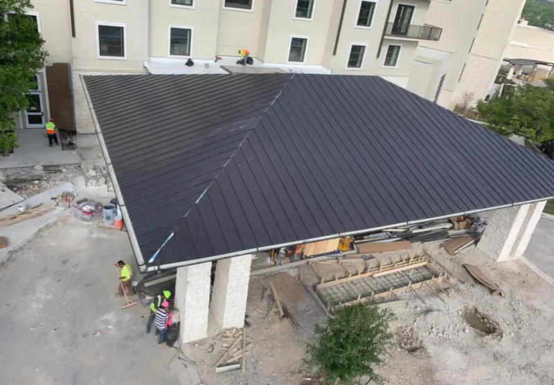 Metal roofing installation team working on a commercial building in Rockmart